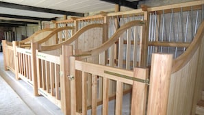 A wooden structure with a curved design, possibly a part of a building's interior.