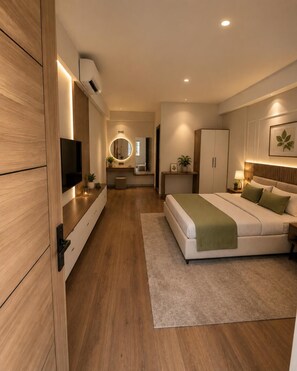 Een moderne slaapkamer met een bed, nachtkastjes, een televisie en een spiegel.