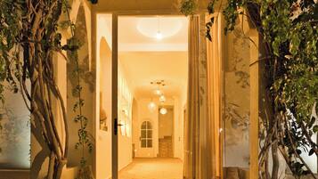 A building entrance with a covered pathway leading to an interior space.