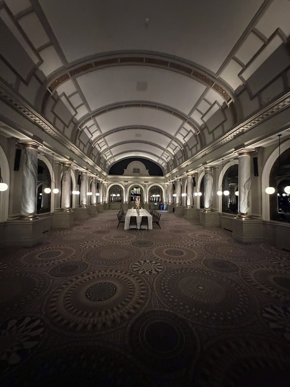 A grand hall with a high arched ceiling, marble columns, and a patterned carpet. - Yellow B&B (York)