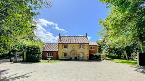 A large, two-story house with a tiled roof, a central entrance, and a paved driveway. - The Gatehouse & Lodge | Large Group Retreat (Holt)