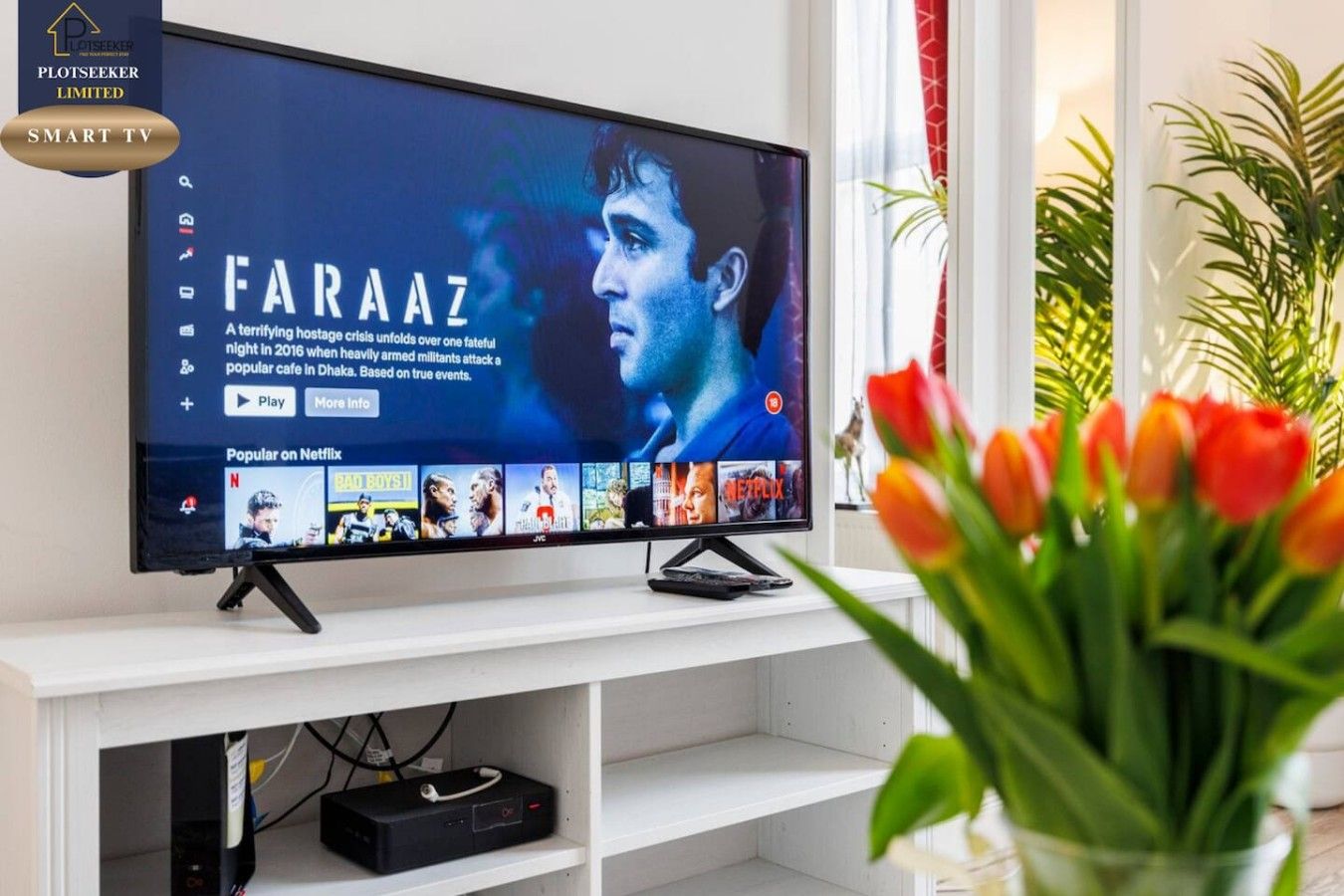 A television displaying a movie titled 'Faraaz' with a synopsis and a play button.