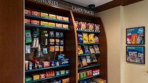 A candy and snack display with various brands and types of products. - Accessible 2BR Suite w/ Kitchen | Free Breakfast! (Harrisburg)