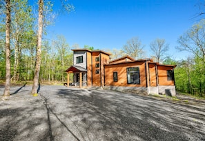 Welcome to your serene retreat: a harmonious blend of rustic wood and elegant brick siding, all nestled within a spacious gravel parking area - 2 Nearby Cabins | Private Heated Pool | Sleeps 34 (Broken Bow)