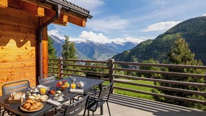 A wooden cabin with a balcony overlooking a mountainous landscape. - Chalet Aramis - Four Bedroom Chalet, Sleeps 8 (Riddes)
