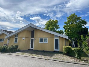 A two-story building with a gabled roof, numbered 51, featuring a front door, windows, and a small porch area. - Favorite Place – the "151-Step House"! (Rechlin)