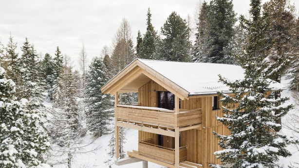 A wooden cabin with a balcony, surrounded by snow-covered trees. - Cabin in Turrach With Balcony and Wi-fi (Stadl-Predlitz)