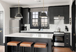Fully equipped kitchen for all of your cooking needs. Drip coffee maker + coffee. Kitchen island with seating for 3. This room opens up into the living room.