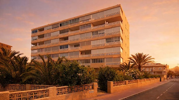 A multi-story hotel with balconies, a paved sidewalk, and palm trees. - LA MATA BEACH · Apartment with a view in La Mata (Torrevieja) for 4 people (La Mata)