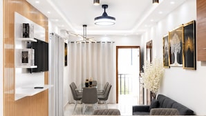 A modern kitchen with a central island, pendant lighting, and a dining area with a table and chairs. - residencial los garcia la romana  (La Romana)