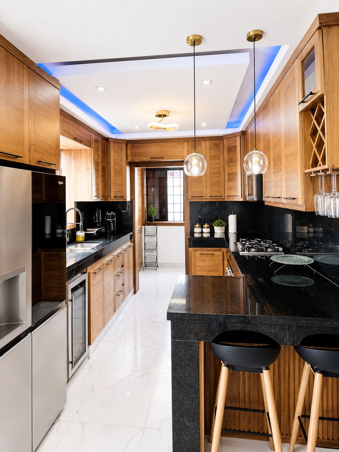 A modern kitchen with wooden cabinets, a black countertop, and a central island with stools.