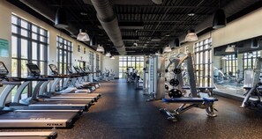 A gym with treadmills, weight machines, and dumbbells. - Spider-man Gamer Paradise + Themed Bedrooms (Kissimmee)