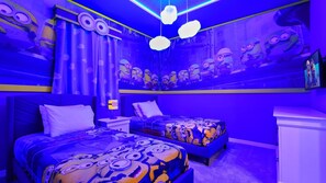 A bedroom with two beds, a nightstand, and a dresser, all decorated with a Minion theme. - Spider-man Gamer Paradise + Themed Bedrooms (Kissimmee)