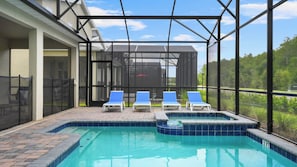 An outdoor swimming pool with lounge chairs and a covered area. - Star Wars & Encanto Bunk Rooms + Pool @ Storeylake (Kissimmee)