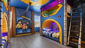 A children's room with a Minions-themed wall, a bed with a banana-themed pillow, and a window with blinds. - Minions, Star Wars, & Frozen-themed Family Retreat (Kissimmee)