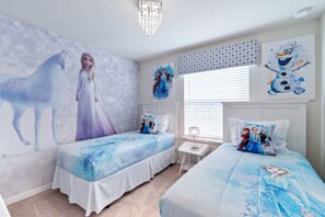 A bedroom with two beds, a large wall mural, and a chandelier. - 5BR @ Solterra Resort w Pool & Disney-themed Rooms (Davenport)