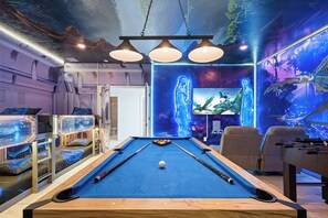 A pool table in a room with bunk beds, a sofa, and a mural of a forest scene. - Avatar Game Room + Harry Potter BR w/ Pool~spa (Kissimmee)