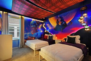 A room with two beds, a large mural, and a patterned ceiling. - 10br Windsor Epic Themed Villa Private Pool (Davenport)