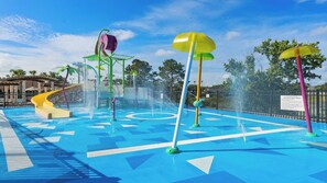 A water park with a blue play area, a yellow slide, and multiple water jets. - Pool, Hot Tub & Nautical Magic Near Disney (Kissimmee)