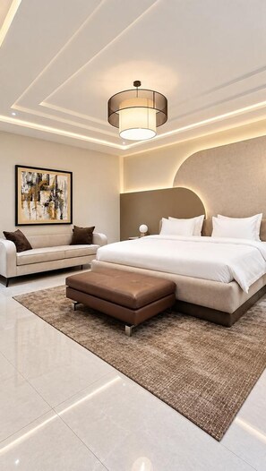A modern bedroom with a large bed, a sofa, and a rug. - The Barli Hotel and Apartments (Abuja)