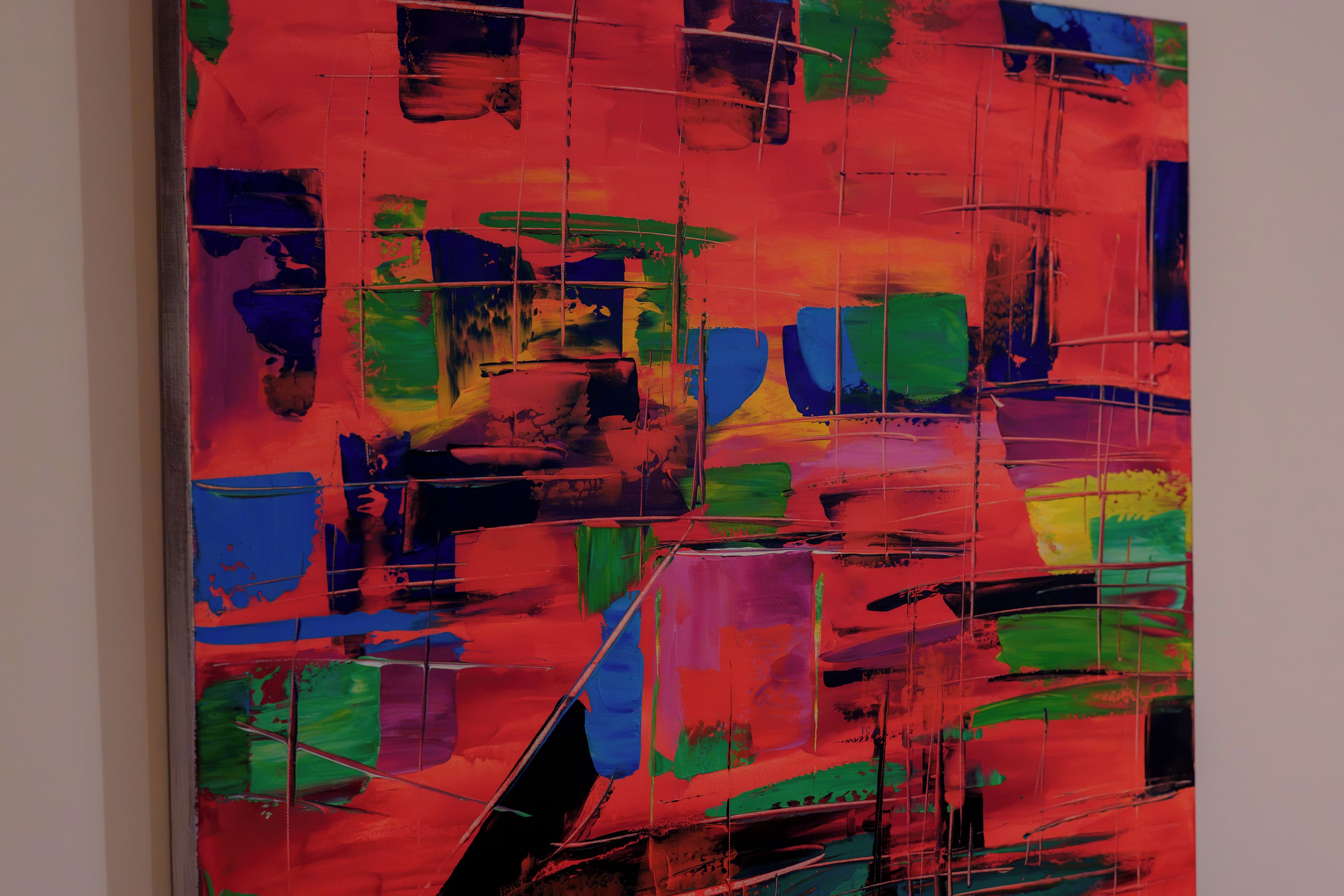 A large abstract painting with a grid-like structure.