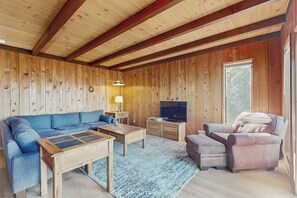 A cozy living room with a sectional sofa, a loveseat, a coffee table, and a television. - Vernal Vista - Inside Yosemite, Deck & Views (Yosemite West)