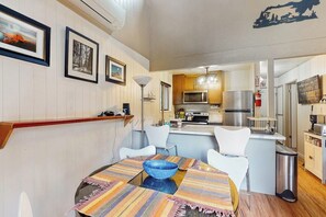 A dining area with a round table, chairs, and a blue bowl. - Snowy Pines - Near Yosemite, Wood Fireplace (Fish Camp)