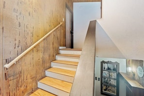 A staircase with wooden steps and a white handrail, leading to a door. - Snowy Pines - Near Yosemite, Wood Fireplace (Fish Camp)