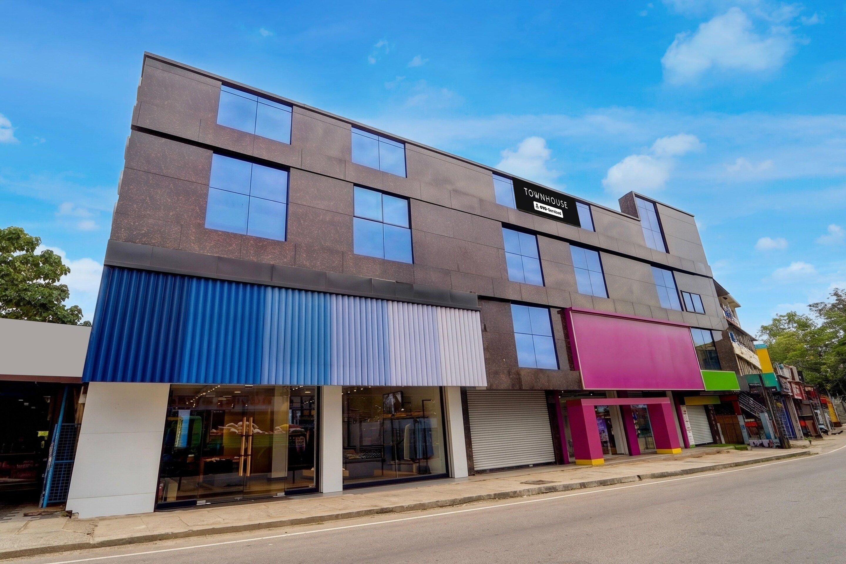 A multi-story building with a storefront on the ground floor.