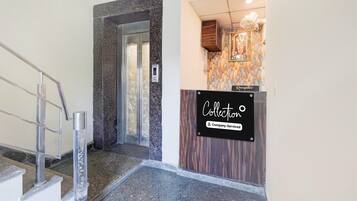A reception area with a sign that reads 'Collection Company-Service.'