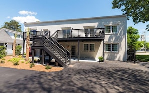 A two-story building with a staircase leading to an upper level.