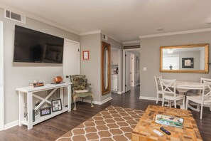 A living room with a television, a coffee table with remote controls, a patterned rug, and a dining area with chairs. -
Walking distance to Miss State campus , very close to downtown Starkville . (Starkville)