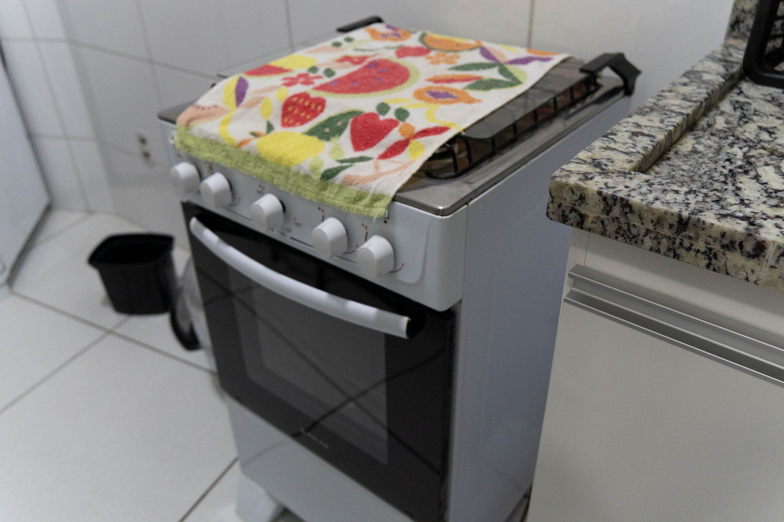 A kitchen with a stove, oven, and a countertop.