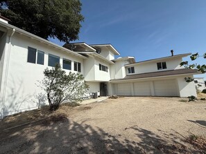 A two-story house with a garage, a small driveway, and a tree in the front yard. - Amazing Ranch Home located on a 155 acre ranch 10 minutes from downtown Paso. (Paso Robles)