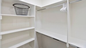 A walk-in closet with open shelving, a metal basket, and a hanging rod. - 3 Master Suites with Private Baths, Kings Beds, Private Hot Tub, EV, BBQ (Washington)