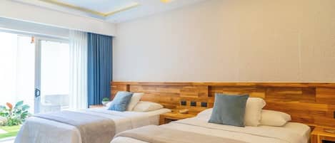 A hotel room with two beds, a wooden headboard, a large window with curtains, and a ceiling with recessed lighting.