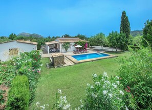 A residential property with a swimming pool, outdoor seating area, and a garden with various plants. - Countryside Retreat in La Font, A/C, Private Pool, Large Garden - 15mins Walk to Old Town Pollenca! (Pollença)