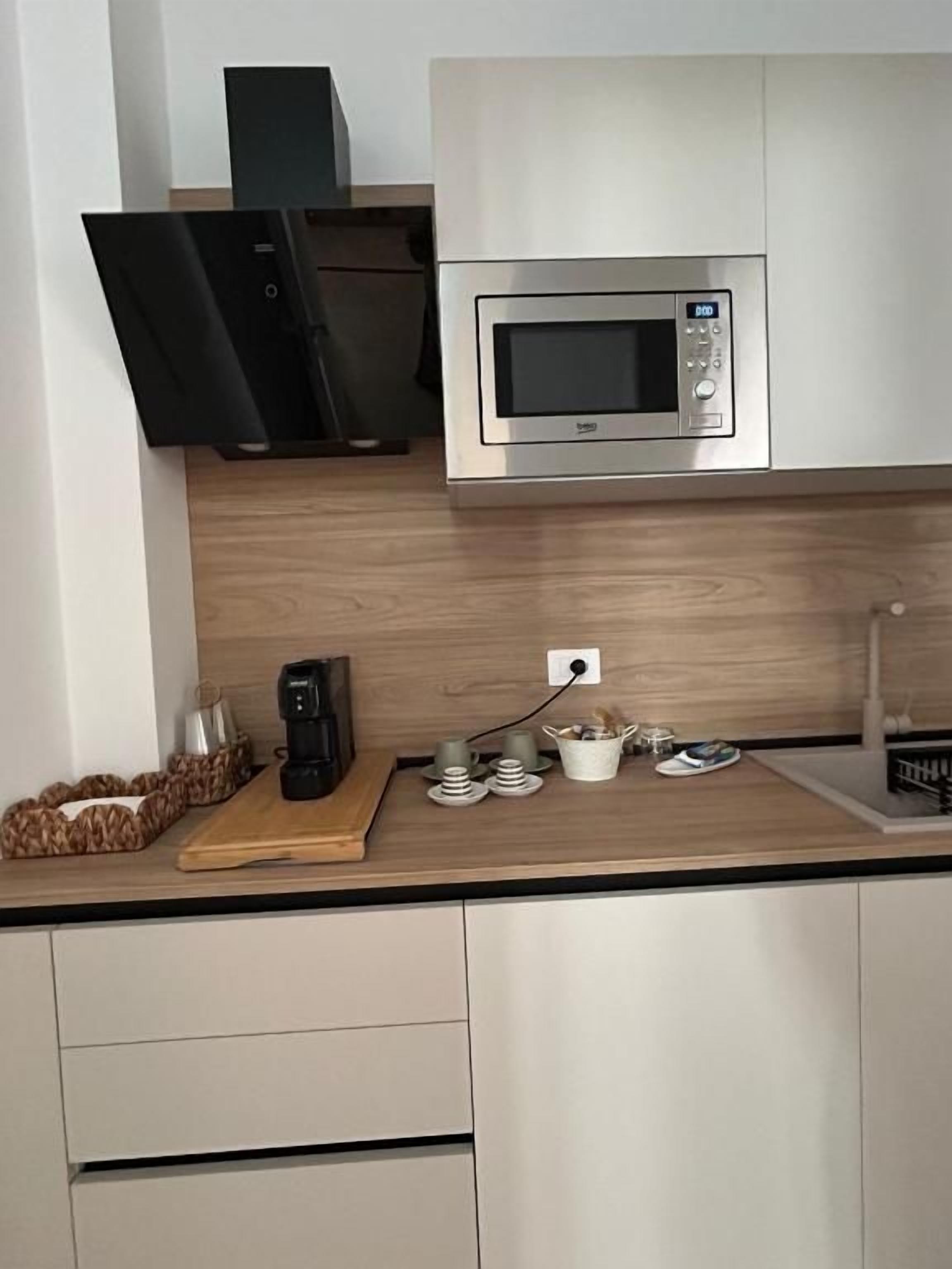 Estudio Confort, balcón, vista a la ciudad | Cocina privada