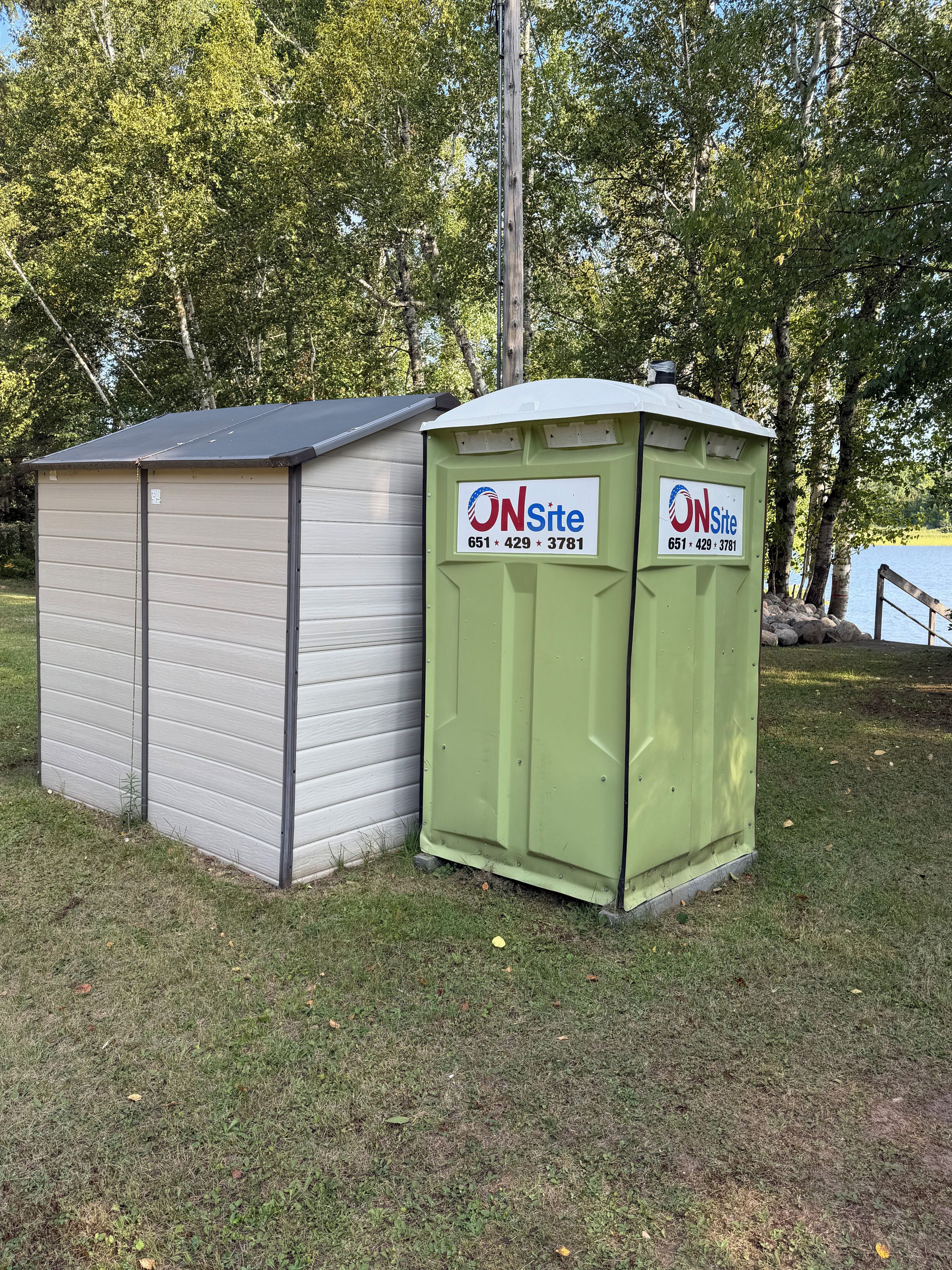 Two portable structures, one beige and one green, with 'ONSite' branding and a contact number.