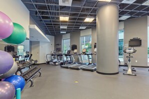 A gym with treadmills, ellipticals, and free weights. - Paradise Park! - Modern Downtown Studio, King Bed + Balcony + Parking (San Diego)