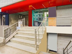 A staircase with metal railings leading to a building entrance. - Deluxe Hotel Sapphire Grand (Ranchi)