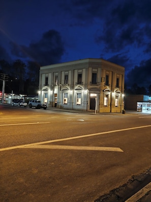 A historic building with a classic architectural style, featuring a symmetrical facade with evenly spaced windows and a central entrance.