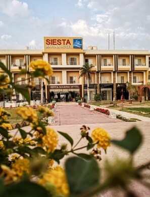 A hotel with a sign reading 'SIESTA MARINA HOTEL' and a visible entrance. - Siesta Marina Hotel (Al-Hammam)