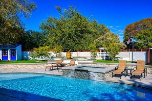 A swimming pool with lounge chairs and a Buddha statue. - Private Villa w/ Pool, Spa, Gym, Sauna, Spectacular Backyard, & 2 miles to Strip (Las Vegas)