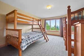 A bunk bed room with a window and a view of trees. - Rock Pond Black Gnat 16 | Saddleback Mountain (Sandy River Plantation)