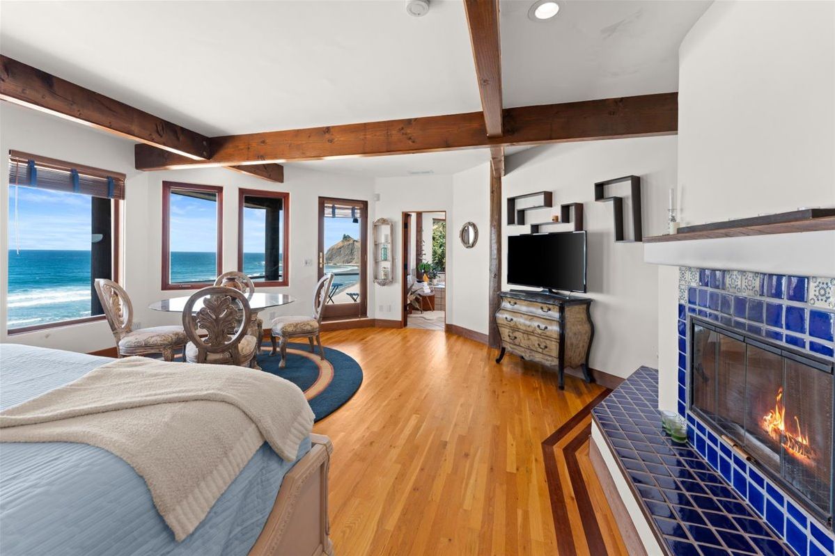 Ocean View Suite: Breathtaking surf views, elegant decor, and a welcoming fireplace await you!