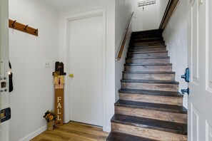 A staircase with wooden steps leading to a landing.