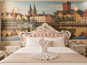 A bedroom with a large bed, ornate headboard, and a mural of a cityscape. - Amory Royal Hotel (Ho Chi Minh City)