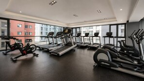 A gym with treadmills, stationary bikes, and ellipticals. - Polanco 20th-Floor Condo: Pool, Gym, City Views (Mexico City)