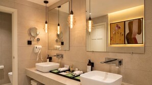 A modern bathroom with two sinks, a large mirror, and pendant lighting. - Wonderful 1-bedroom hotel suites with AC in Islamabad Capital Territory (Islamabad Capital Territory)